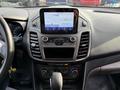 Interior dashboard of a 2020 Ford Transit Connect featuring a touchscreen display and control knobs for audio and climate settings