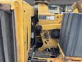 A 2015 Vermeer Corporation BC1200XL brush chipper featuring a yellow exterior with various mechanical components and controls visible in the image