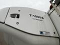 Close-up of a white Thermo King refrigeration unit labeled T-1080S whisper attached to a truck
