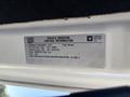 A label showing vehicle emission control information for a 2017 Chevrolet Colorado with details on its diesel engine and EPA regulations