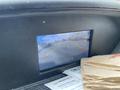 Display screen of a 2019 Ford Transit showing a rearview camera feed with guidelines and nearby vehicles