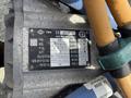 A metal plate displaying specifications and details of a 2022 Lion Lion6 electric motor including model number, power, voltage, and cooling system information