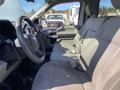 Interior view of a 2018 Ford F-150 showing gray fabric seats and steering wheel