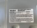 2016 Isuzu NPR-HD with a label detailing vehicle emission control information and maximum certified nominal fuel tank capacity of 30 gallons