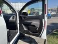 2017 Chevrolet Colorado with an open driver-side door showcasing the interior details and door panel design