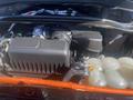 Close-up of the engine compartment of a 2020 Ford Explorer showing the air intake system and various engine components