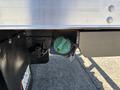 A green gauge mounted on a truck's side showing the caution level with a key attached