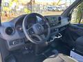Interior view of a 2024 Mercedes-Benz Sprinter 2500 featuring a steering wheel dashboard touch screen and cup holders