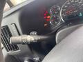 Close-up view of the steering column controls in a 2018 Chevrolet Express including turn signal and wiper controls