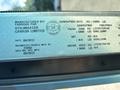 A metal plate detailing specifications of a 2012 Ford E-450 including weight ratings and manufacturing information