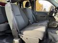 Interior view of a 2013 Chevrolet Silverado 3500HD showing front seats with fabric upholstery and seatbelts