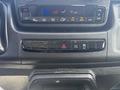 Dashboard controls of a 2022 RAM Promaster 350 featuring climate control buttons and warning lights