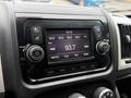 Dashboard of a 2020 RAM Promaster with a digital radio display showing frequency 93.7 and control buttons for volume tuning and other settings