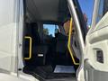 A 2022 Lion Lion6 electric truck with an open door revealing the driver's seat and interior features including yellow grab bars and a welcome mat on the floor