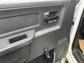 Close-up of the interior door panel of a 2011 Dodge Ram 5500 featuring a handle and window controls