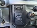 Control panel of a 2024 Ford F-550 featuring drive mode selector and knobs for adjusting settings