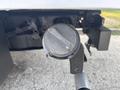 Close-up of a 2009 Ford F-550 hitch receiver with a cover attached and a silver metal ball on the end
