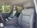 Interior of a 2020 Chevrolet Silverado with gray leather front seats and a center console