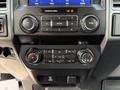 Interior control panel of a 2021 Ford F-350 SD featuring audio controls climate settings and a digital display screen