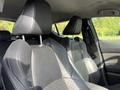 Interior view of a 2021 Toyota C-HR showing two front seats with black upholstery and headrests