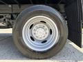 Close-up of a silver wheel and tire from a 2019 Ford F-550 showcasing the rim and tread design