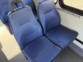 Two blue upholstered seats from a Chevrolet Express, designed for passenger comfort with a textured finish and armrests