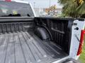 A 2021 Ford F-150 with a textured truck bed showing the side wall and wheel well area