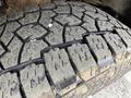 Close-up of a worn tread pattern on a tire from a 2017 Chevrolet Express showcasing deep grooves and wear indicative of heavy use