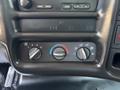 Dashboard controls of a 2007 GMC C4500 TopKick featuring knobs for climate control with settings for fan speed and temperature adjustment