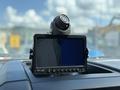 A 2017 Ford F-550 dashboard display with a mounted camera and a screen showing two views one black and one blue