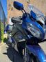 A 2016 Yamaha FJR1300AE motorcycle in blue with a sleek design featuring a fairing and saddlebags positioned at an angle for a dynamic view