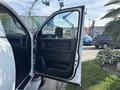 A 2013 RAM 5500 truck with an open driver's side door showcasing the interior door panel and window