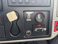 Dashboard controls of a 2012 International 7300 Workstar with a backup alarm switch a filter minder gauge and other functional buttons
