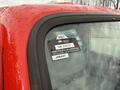 A close-up of a 2001 Toyota Dyna's windshield showing a certification sticker with various details including a year and month