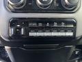 Control panel of a 2021 RAM 5500 featuring various buttons for lift gate tow/haul and auxiliary functions