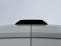 A rear view of a 2020 Ford Transit 250 showing the top of the vehicle with an antenna and a smooth white surface