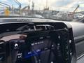 Dashboard of a 2021 RAM 1500 showing the radio display and climate control settings