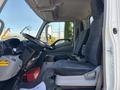 Interior of a 2018 Hino 195 showing the driver's seat steering wheel and dashboard with controls and seating for one passenger