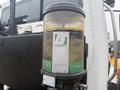 A close-up of a wet fuel filter on a 2016 Freightliner 108SD showing the Groeneveld logo and product information