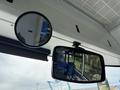 Interior view of a 2018 Grande West Vicinity bus showing two mirrors one round and one rectangular reflecting empty seats
