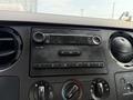 Dashboard of a 2008 Ford F-450 SD featuring a radio and climate control knobs