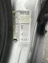 A 2018 Ford Focus vehicle identification number and specifications label attached to the driver's side door jamb