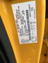 A yellow label affixed to the side of a 2017 Ford F-250 SD showing vehicle specifications and information