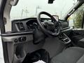 Interior view of a 2020 Ford Transit showing the dashboard steering wheel and controls with a touchscreen display