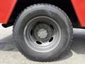 A close-up view of a wheel on a 2013 Ford F-550 featuring a dark rim and a large tire with visible tread patterns