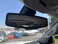The image shows the rearview mirror of a 2017 Chevrolet Colorado with buttons for features like dimming and a digital readout