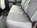 2017 Ford F-250 SD interior focused on the rear bench seat featuring gray fabric upholstery and seat belts