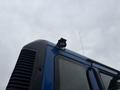 A blue 2017 Autocar Xpert with a spotlight mounted on the roof and an antenna extending from the top edge