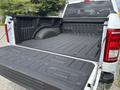 A 2017 Ford F-150 with an open truck bed featuring a textured black liner and side walls