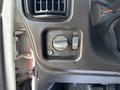 Close-up of the control panel for lighting and air circulation in a 2007 GMC C4500 TopKick featuring knobs for headlight brightness and air vent direction